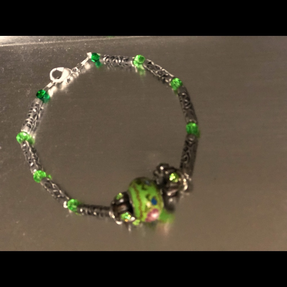 Costume jewelry. Woman’s bracelet, silver with unusual green flowered bead.